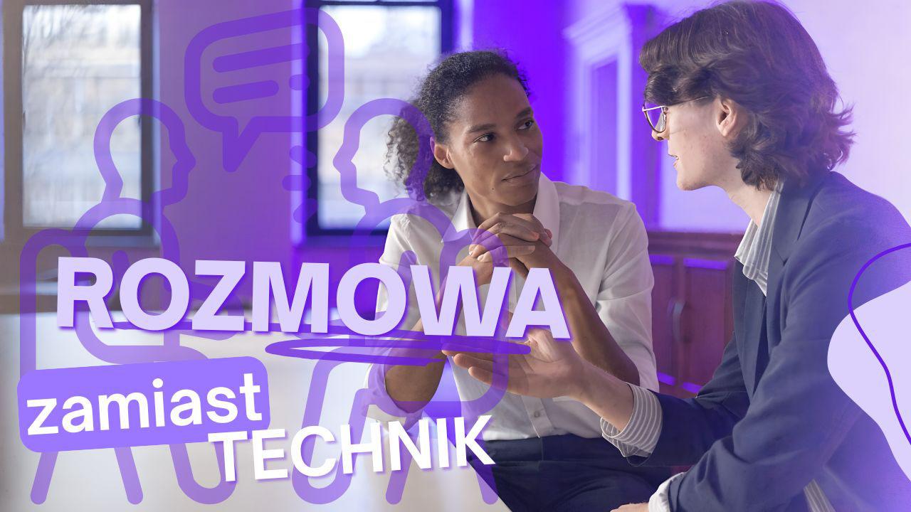 Dwie osoby rozmawiają przy stole w profesjonalnym wnętrzu